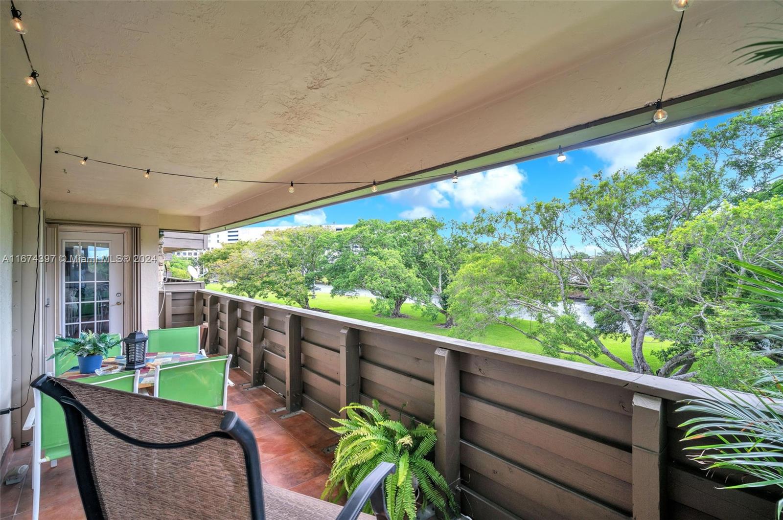 8335 Southwest 72nd Avenue, Unit 312D Miami, FL 33143 - Photo 24 of 45 a view of a chairs and table in the balcony