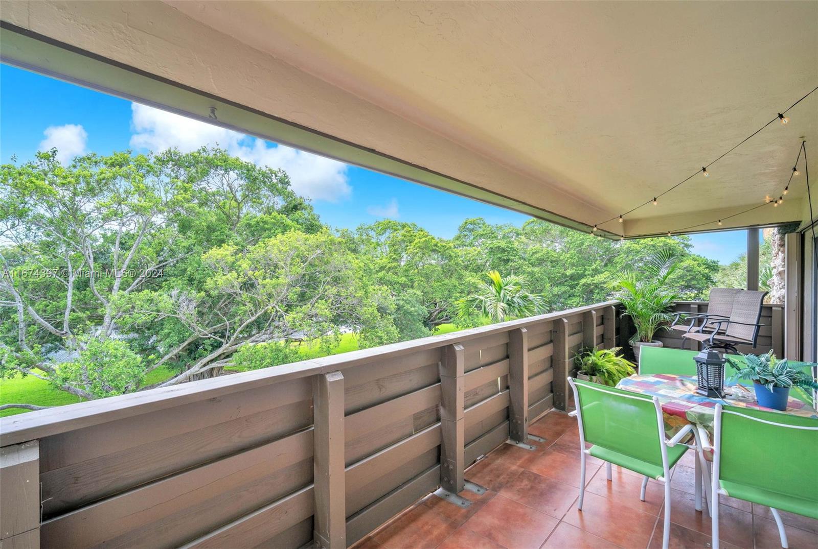 8335 Southwest 72nd Avenue, Unit 312D Miami, FL 33143 - Photo 26 of 45 a view of a two chair in the balcony