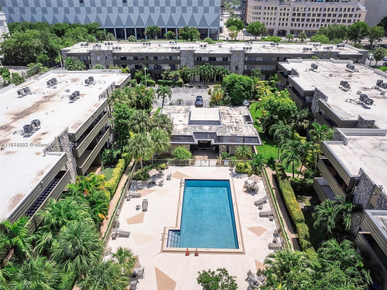 8335 Southwest 72nd Avenue, Unit 312D Miami, FL 33143 - Photo 27 of 45 an aerial view of a house with a yard basket ball court and outdoor seating
