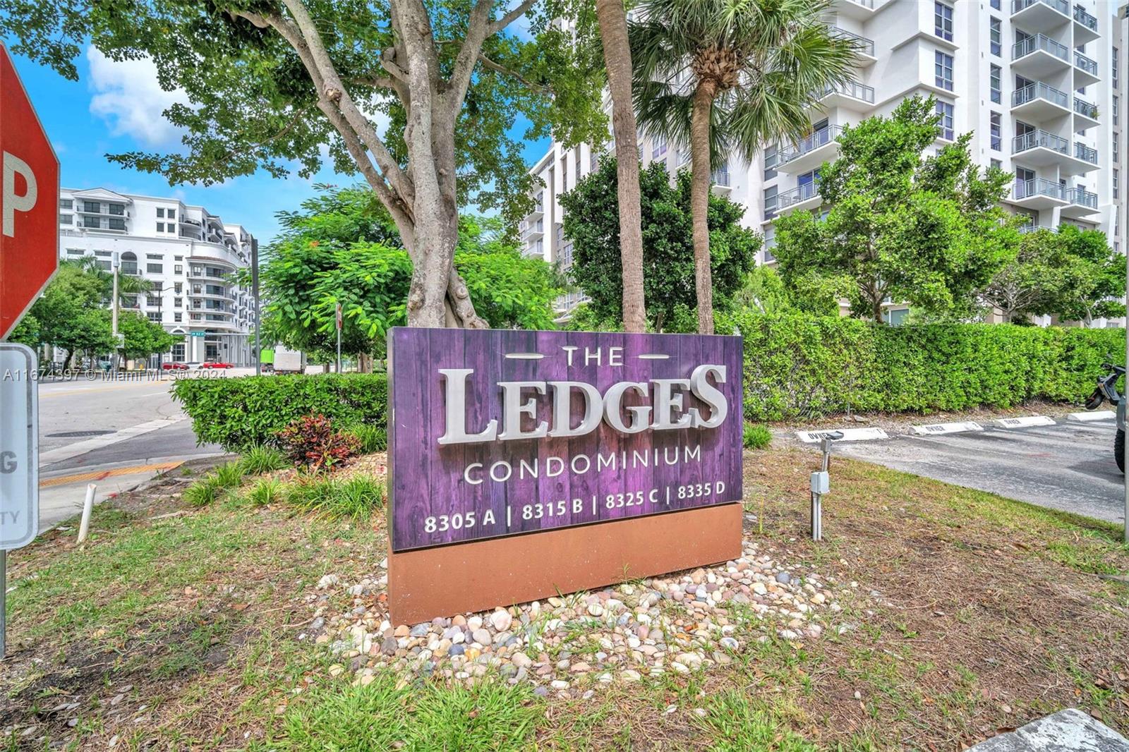 8335 Southwest 72nd Avenue, Unit 312D Miami, FL 33143 - Photo 30 of 45 a sign on the side of the road
