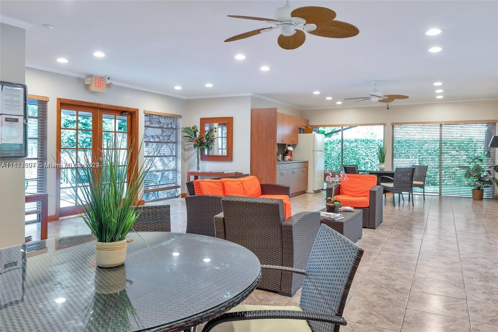 8335 Southwest 72nd Avenue, Unit 312D Miami, FL 33143 - Photo 34 of 45 a living room with furniture and a potted plant