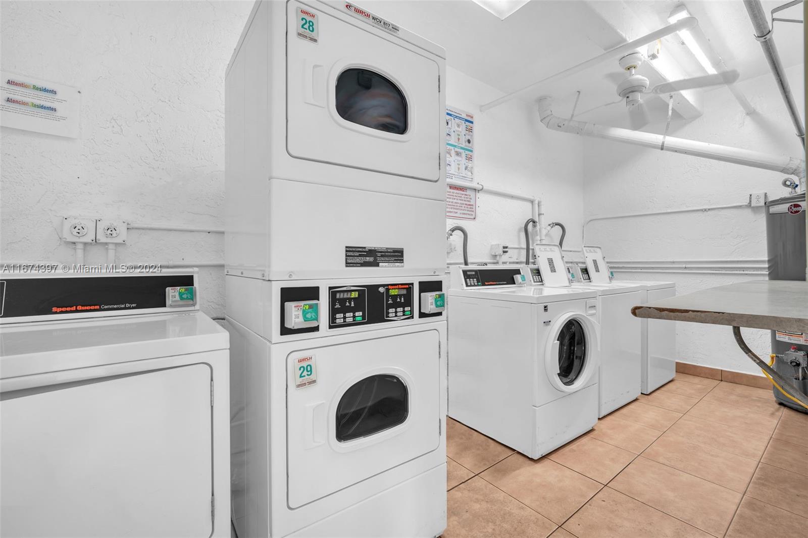 8335 Southwest 72nd Avenue, Unit 312D Miami, FL 33143 - Photo 35 of 45 a utility room with dryer and washer