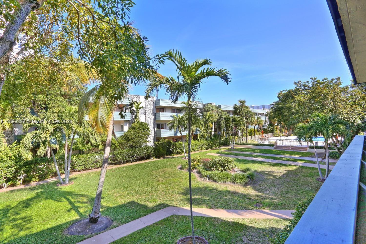 8335 Southwest 72nd Avenue, Unit 312D Miami, FL 33143 - Photo 42 of 45 a view of a park with a tree