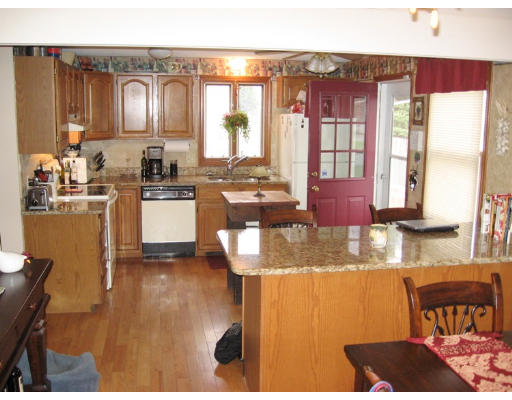 77 Bither Street Springfield, MA 01118 - Photo 3 of 10 a kitchen with stainless steel appliances granite countertop a sink and cabinets
