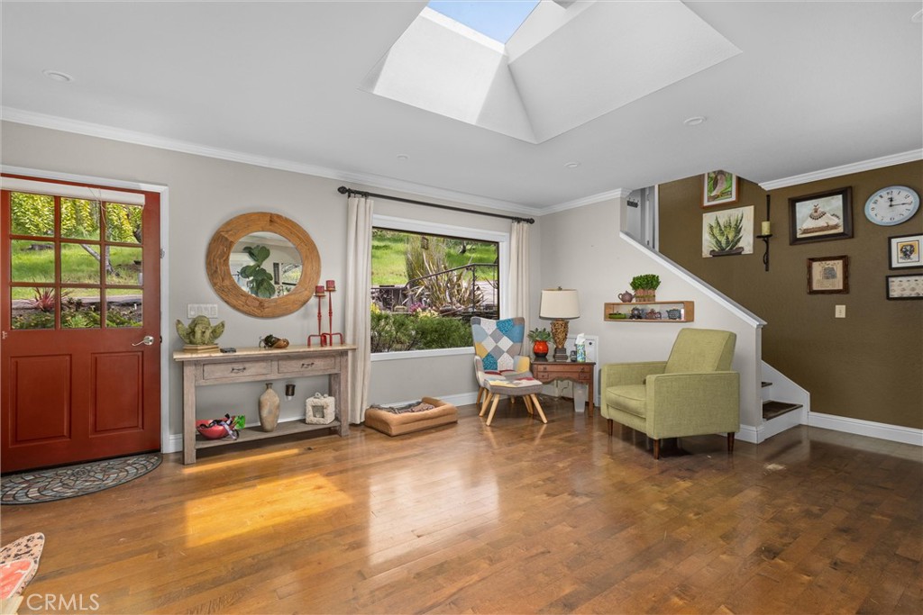 1981 Benson Avenue Cambria, CA 93428 - Photo 8 of 35 Other view of living room, showing stairs to primary suite over garage.