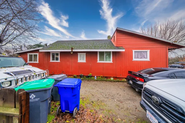 an aerial view of a swimming pool with outdoor seating