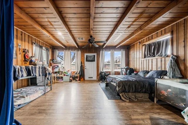 a view of a hall with wooden floor
