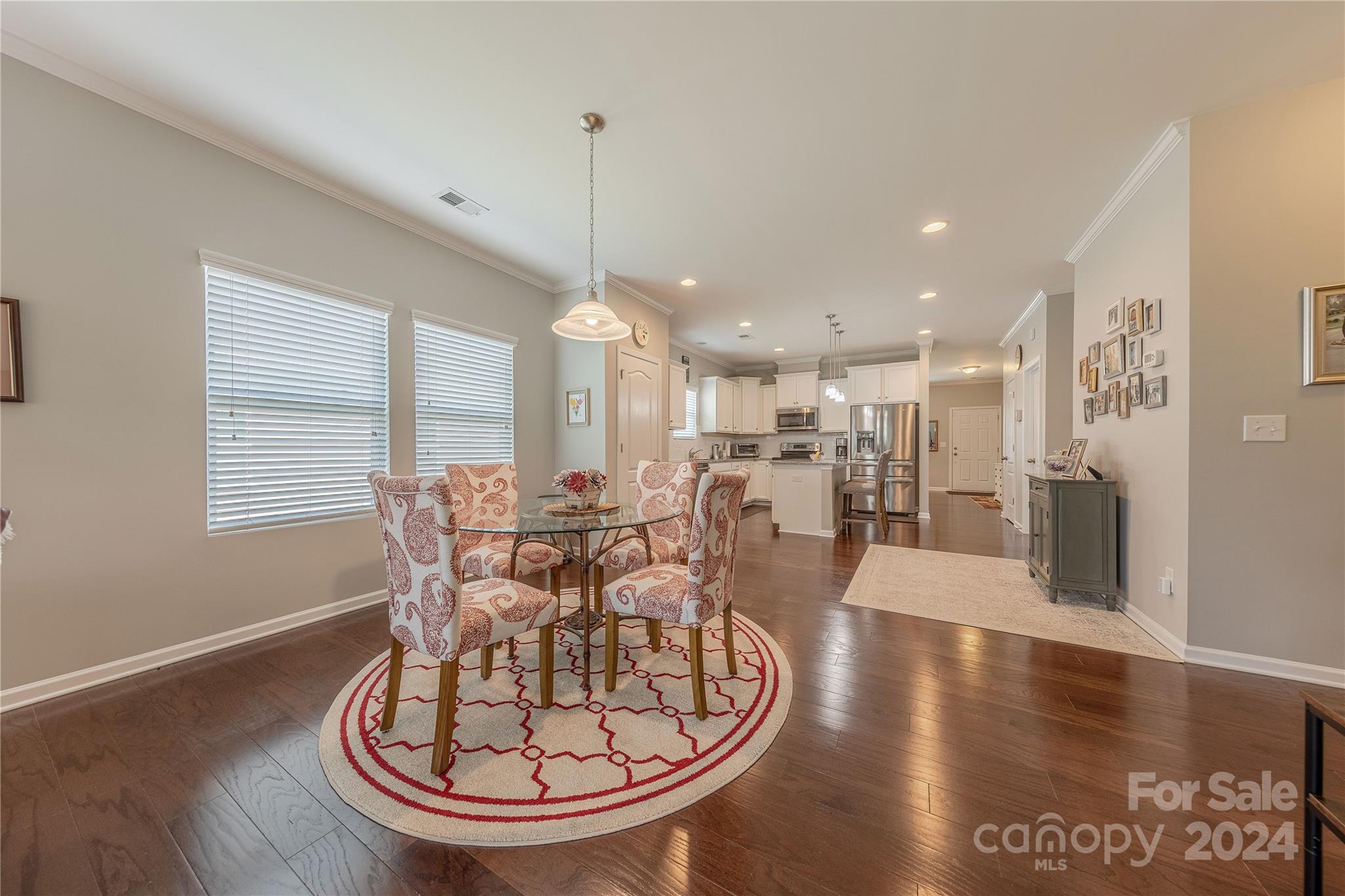 5824 Eleanor Rigby Road Charlotte, NC 28278 - Photo 13 of 34 a view of a dining room with furniture window and wooden floor