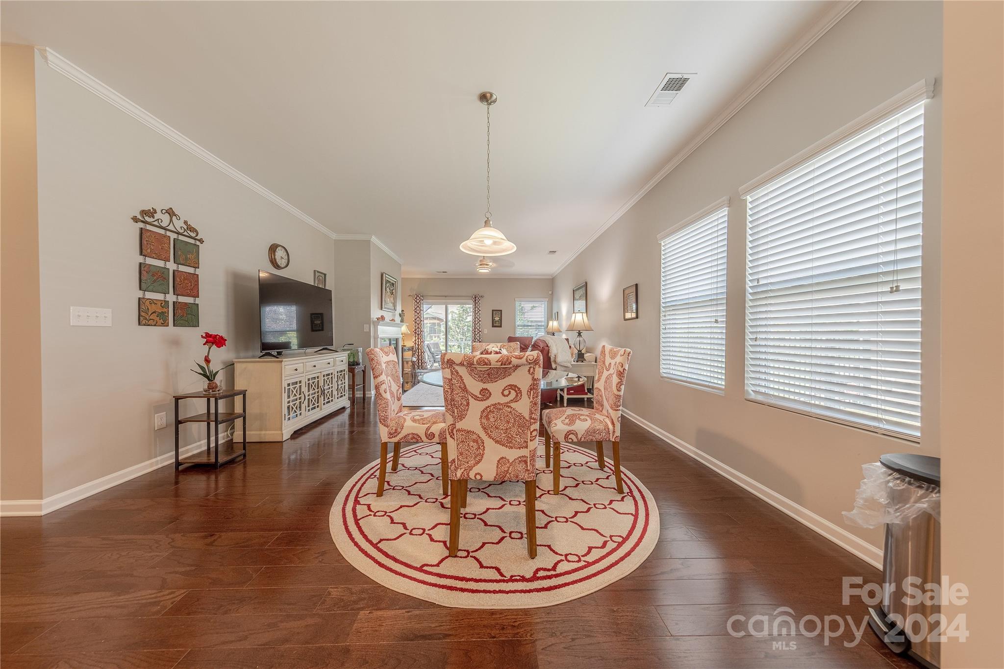 5824 Eleanor Rigby Road Charlotte, NC 28278 - Photo 14 of 34 a living room with furniture a flat screen tv and a large window