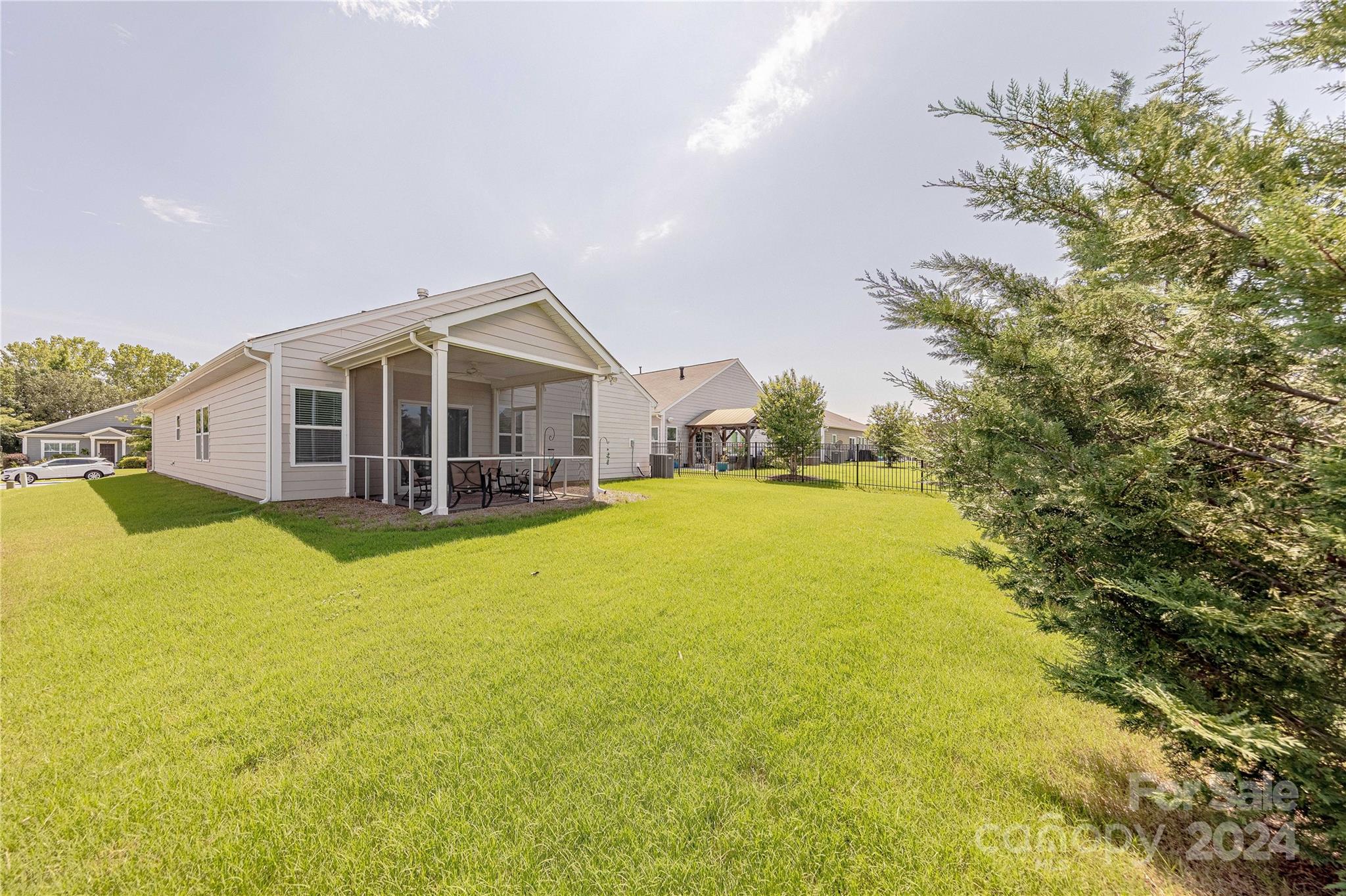 5824 Eleanor Rigby Road Charlotte, NC 28278 - Photo 31 of 34 a view of a house with a big yard and large trees