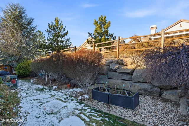a view of a backyard with sitting area
