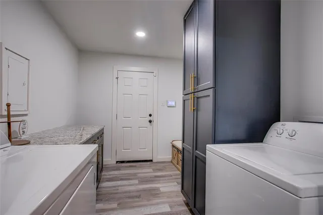 a view of storage and utility room with washer and dryer