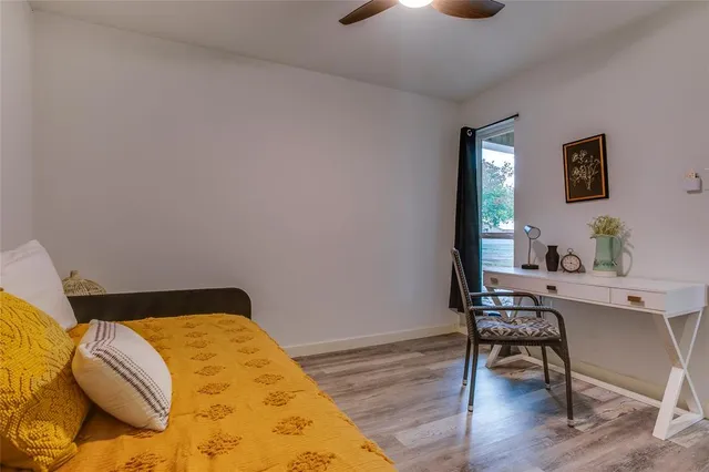 a bedroom with a bed and a table in it