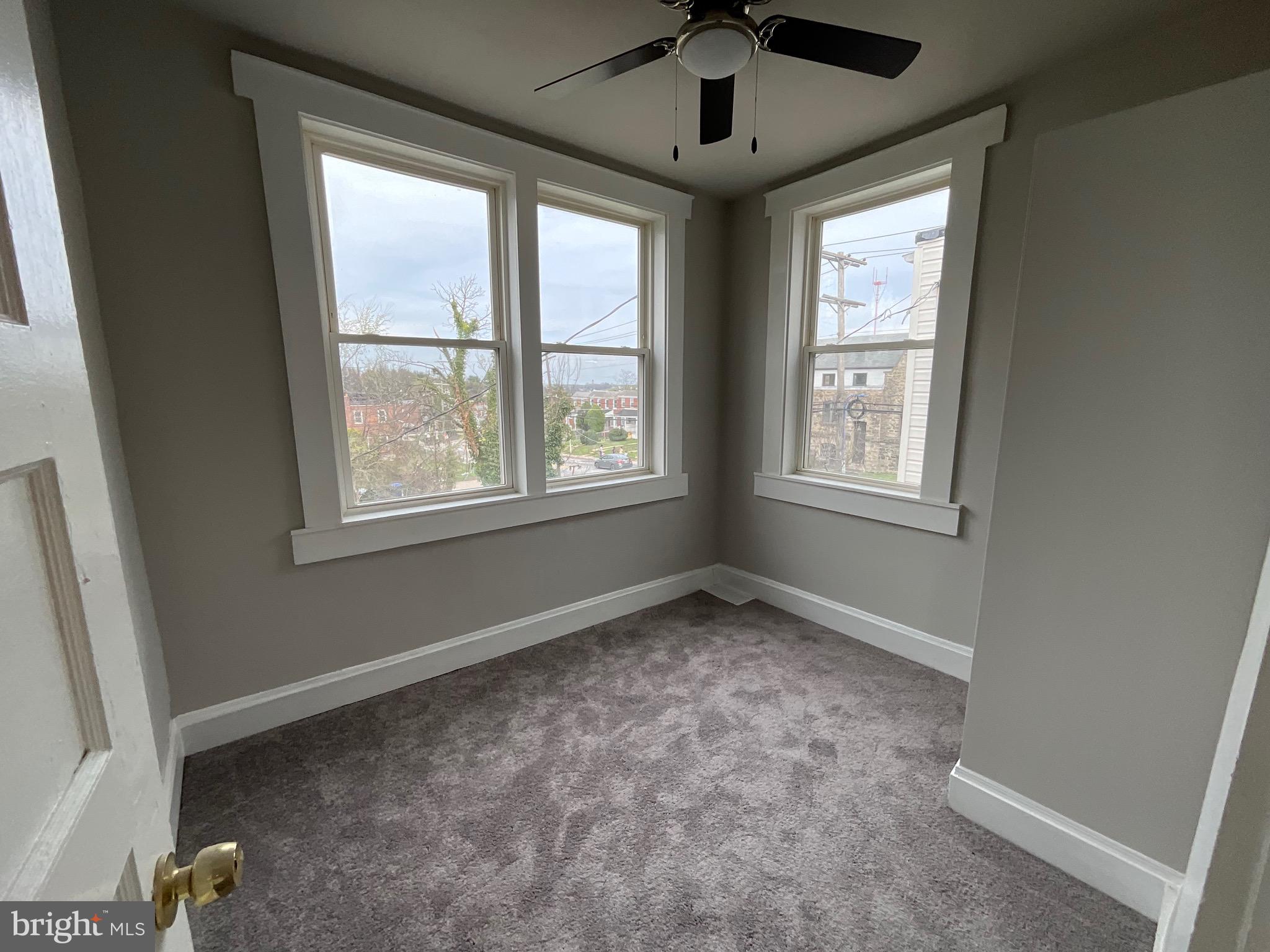 4415 Pimlico Road Baltimore, MD 21215 - Photo 13 of 18 a view of an empty room with a window