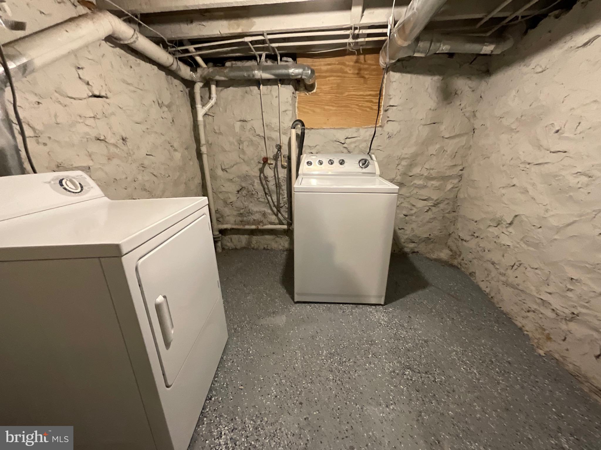 4415 Pimlico Road Baltimore, MD 21215 - Photo 15 of 18 a utility room with dryer and washer