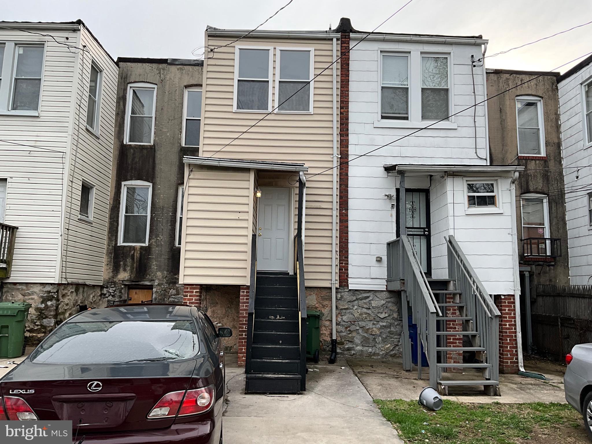 4415 Pimlico Road Baltimore, MD 21215 - Photo 16 of 18 a car parked in front of a house