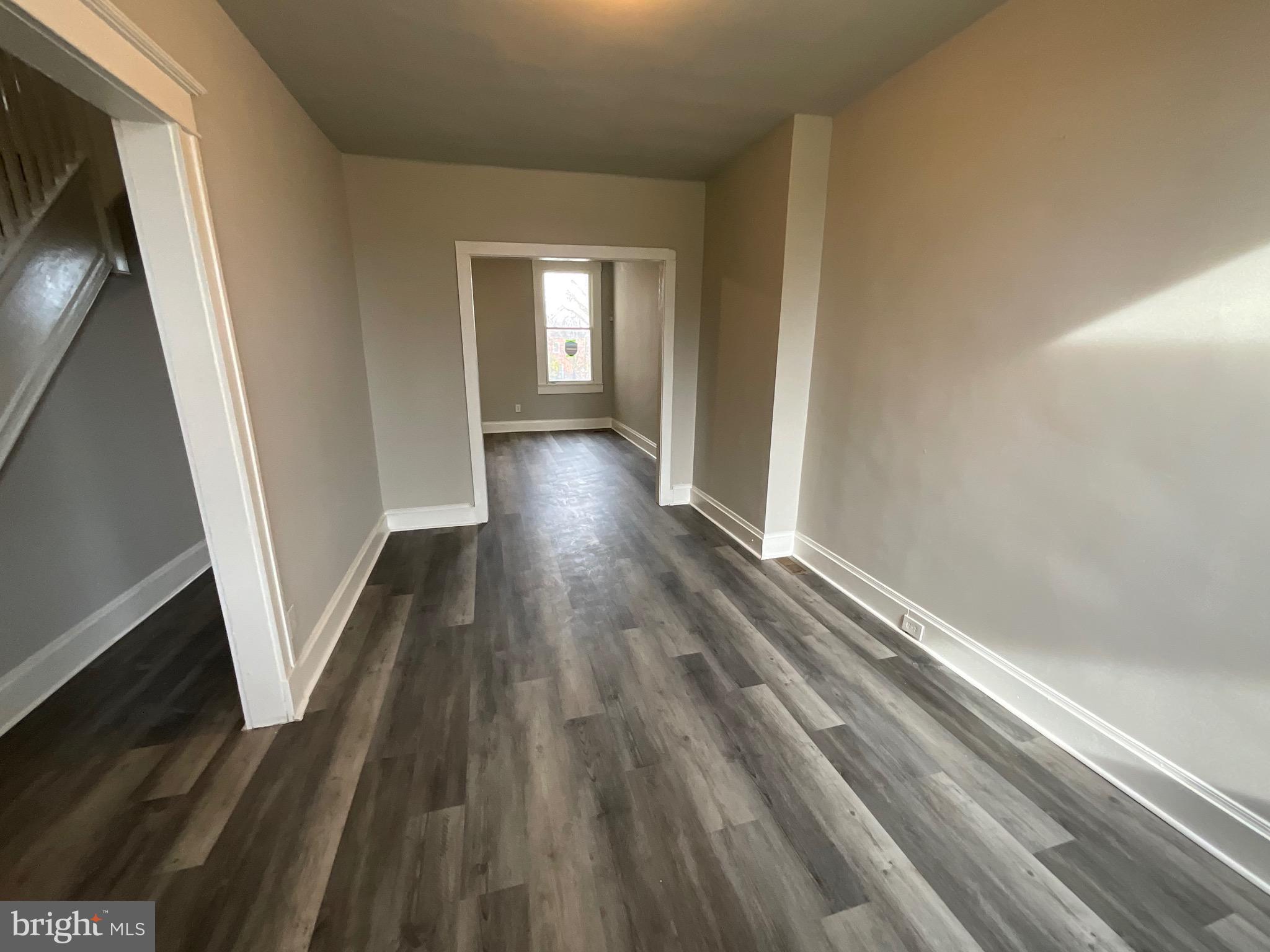 4415 Pimlico Road Baltimore, MD 21215 - Photo 3 of 18 a view of hallway with wooden floor