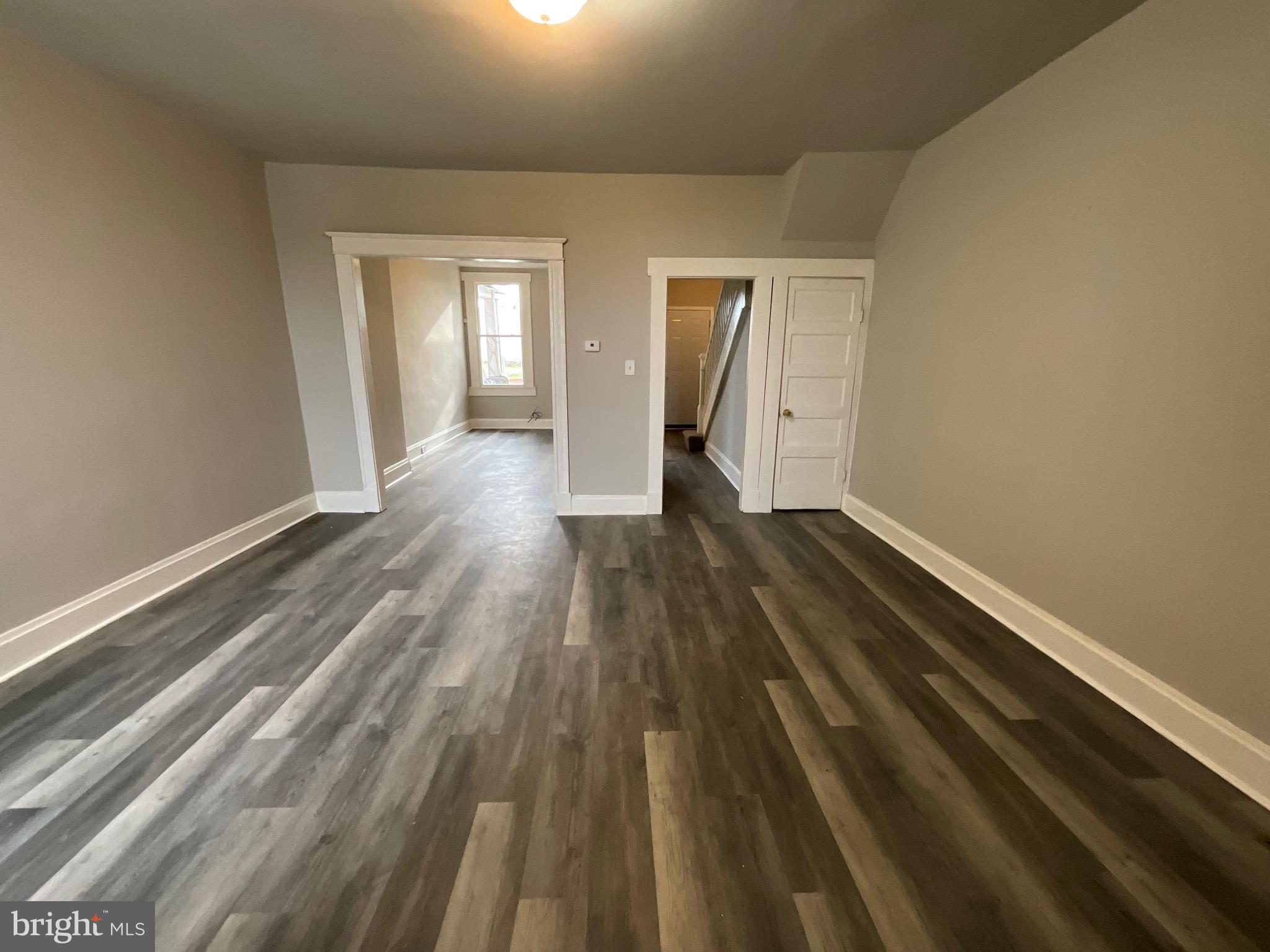 4415 Pimlico Road Baltimore, MD 21215 - Photo 4 of 18 a view of wooden floor in an empty room