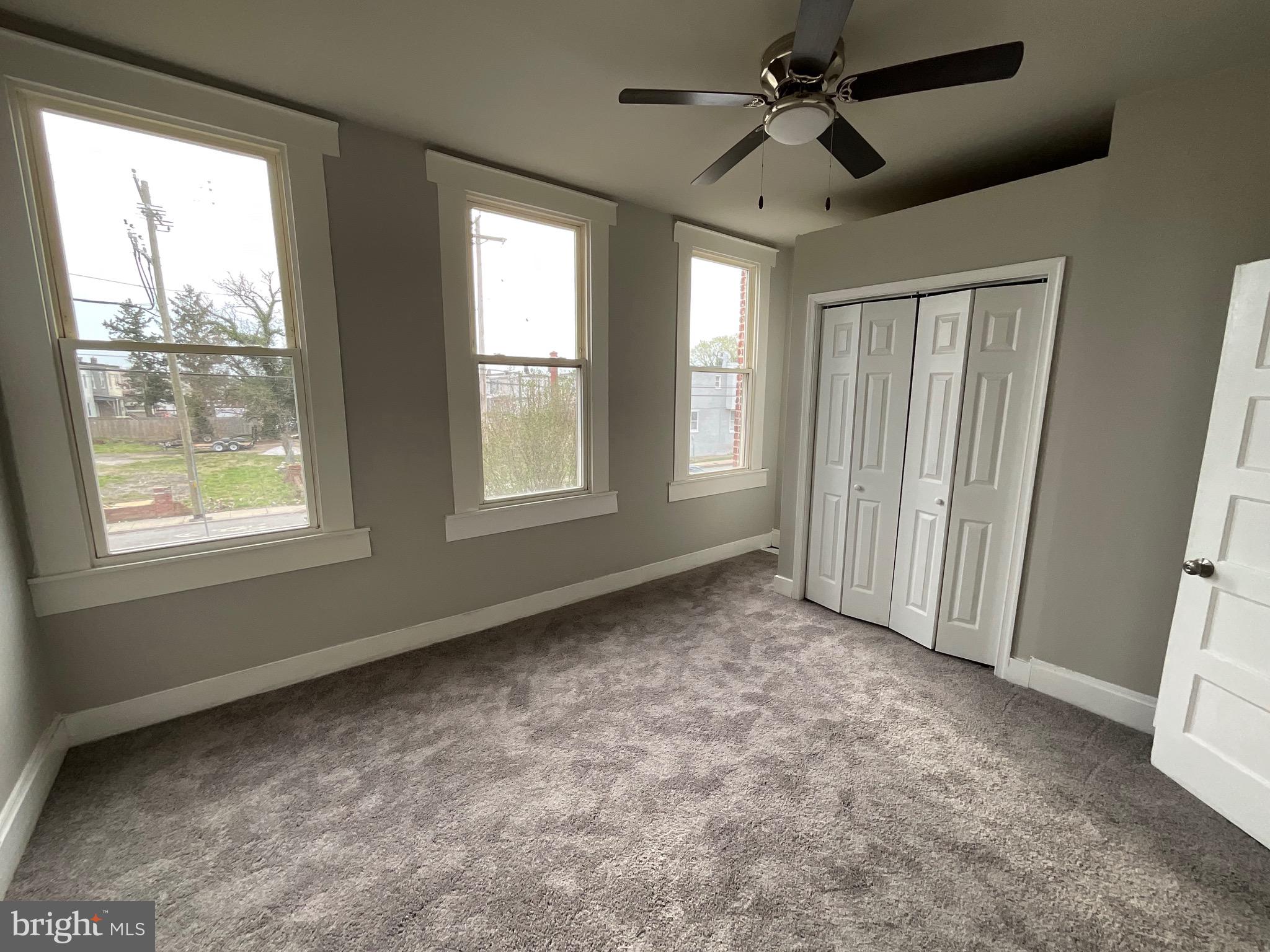4415 Pimlico Road Baltimore, MD 21215 - Photo 7 of 18 a view of an empty room with a window