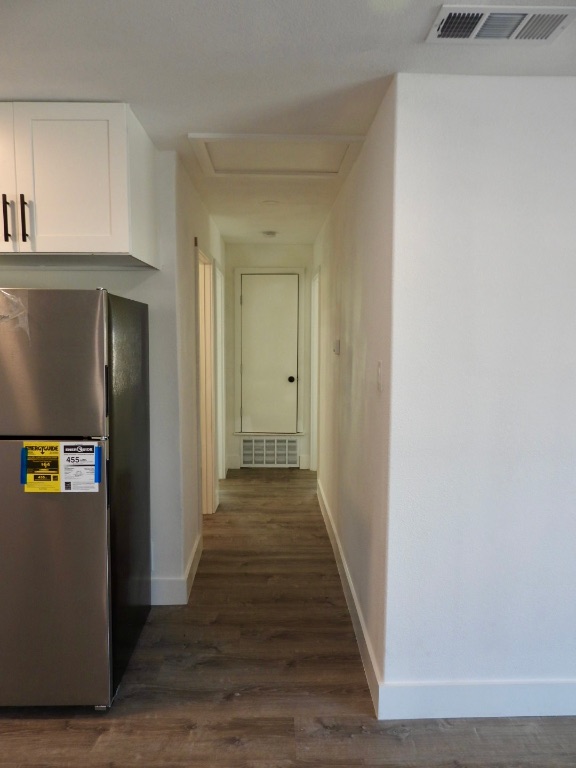 1619 Rutland Drive, Unit A Austin, TX 78758 - Photo 5 of 14 a view of a hallway with wooden floor