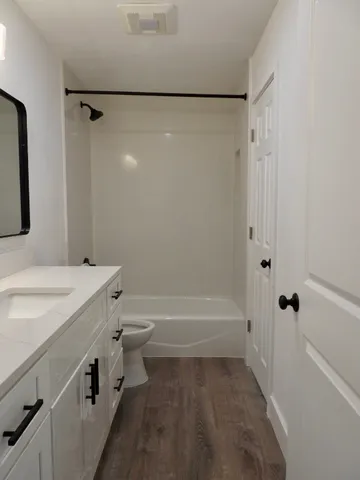 a bathroom with a bathtub a sink and a shower