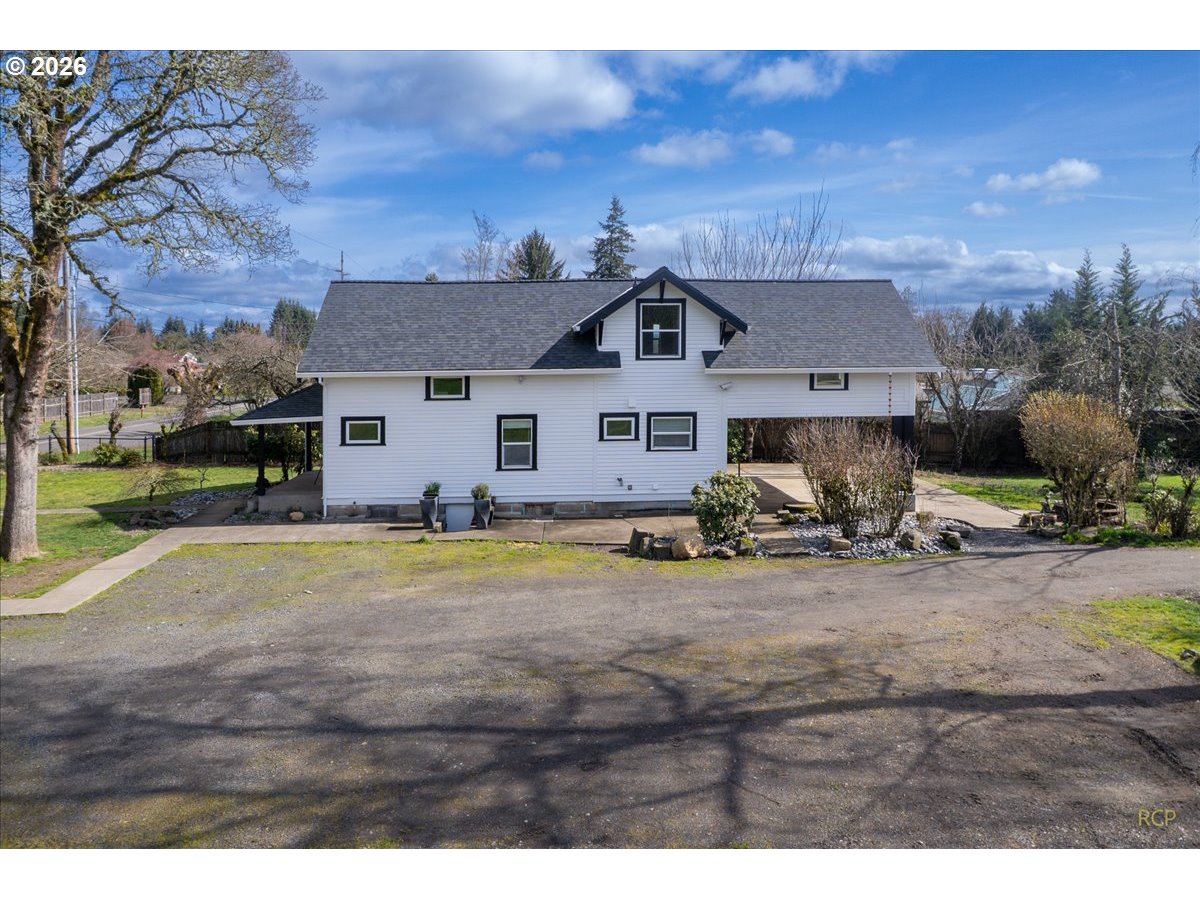 34418 Berg Road Warren, OR 97053 - Photo 28 of 39 a view of a house with backyard and a tree