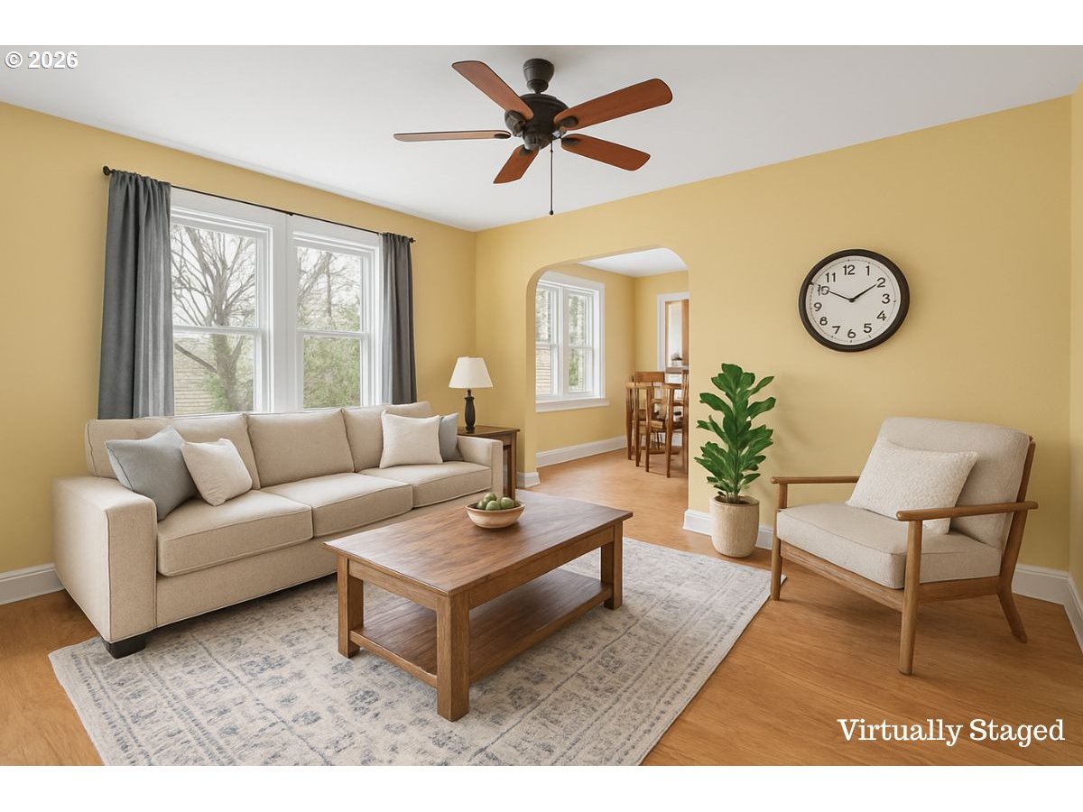 34418 Berg Road Warren, OR 97053 - Photo 5 of 39 a living room with furniture a clock and a large window
