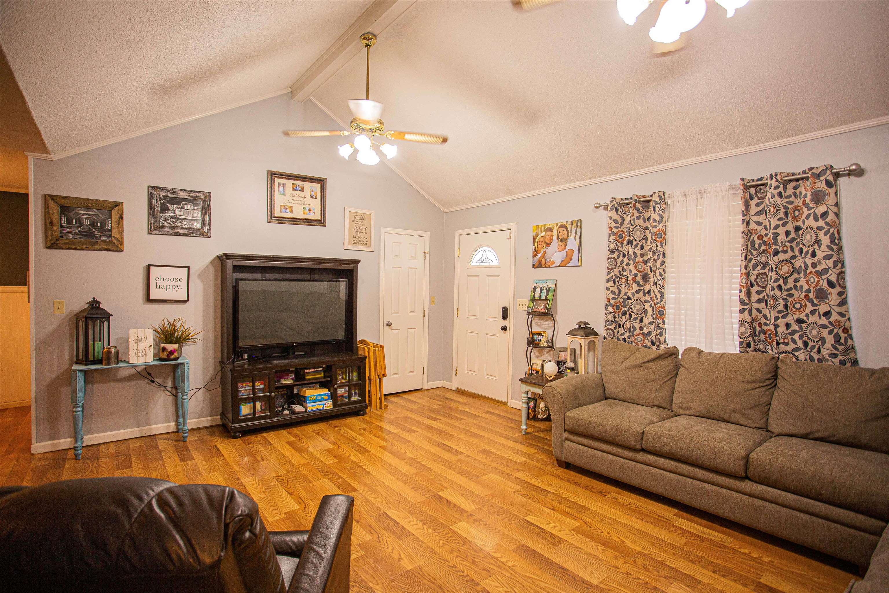 370 Dr Lewis Road Ripley, TN 38063 - Photo 2 of 25 a living room with furniture and a flat screen tv