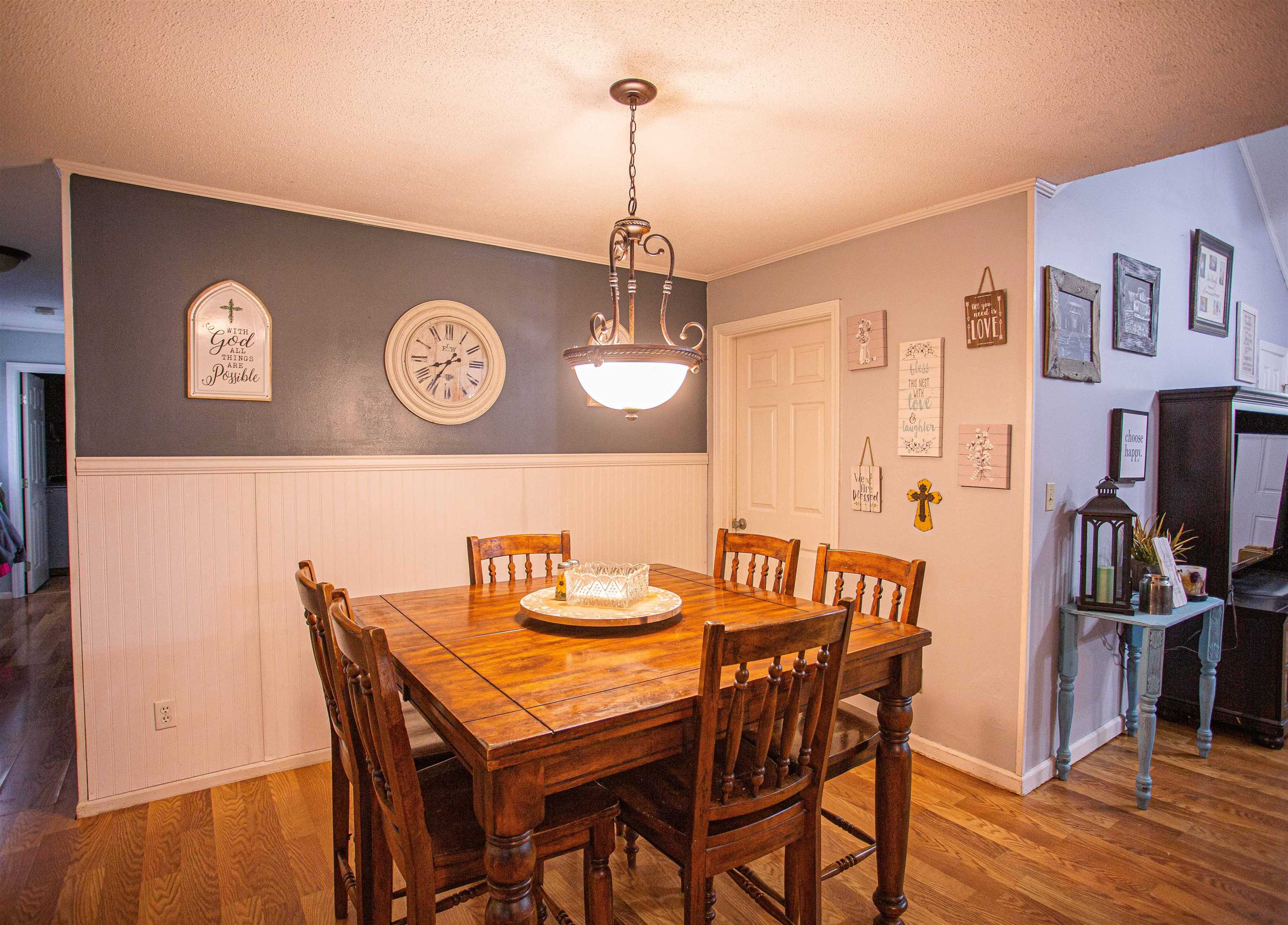370 Dr Lewis Road Ripley, TN 38063 - Photo 8 of 25 a view of a dining area with furniture and wooden floor