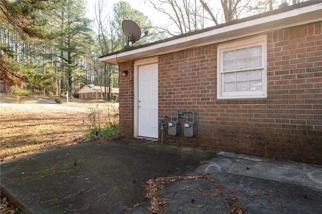 a view of a backyard of the house