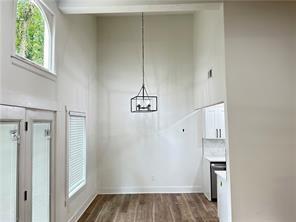 3155 Tangerine Court, Unit 3155 Decatur, GA 30034 - Photo 4 of 24 a view of a kitchen with wooden floor and a window