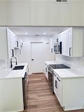 3155 Tangerine Court, Unit 3155 Decatur, GA 30034 - Photo 6 of 24 a kitchen with a stove a sink and a refrigerator