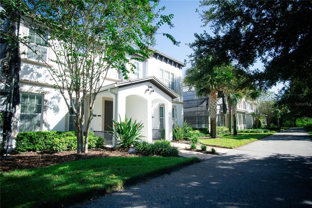 11636 Water Run Alley Windermere, FL 34786 - Photo 3 of 18 a front view of a house with garden