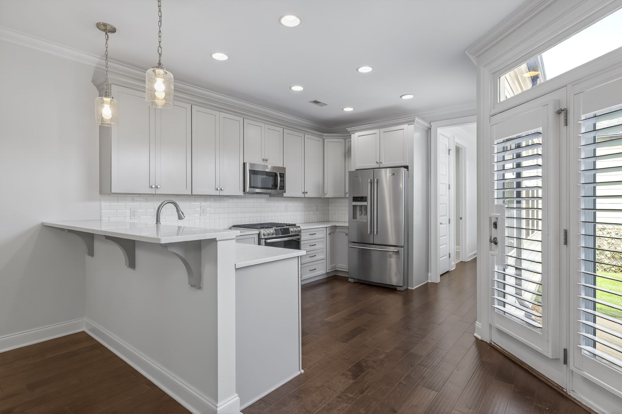 3062 Cheever Street Franklin, TN 37064 - Photo 15 of 51 a kitchen with stainless steel appliances granite countertop a refrigerator a sink dishwasher a stove and white countertops with wooden floor