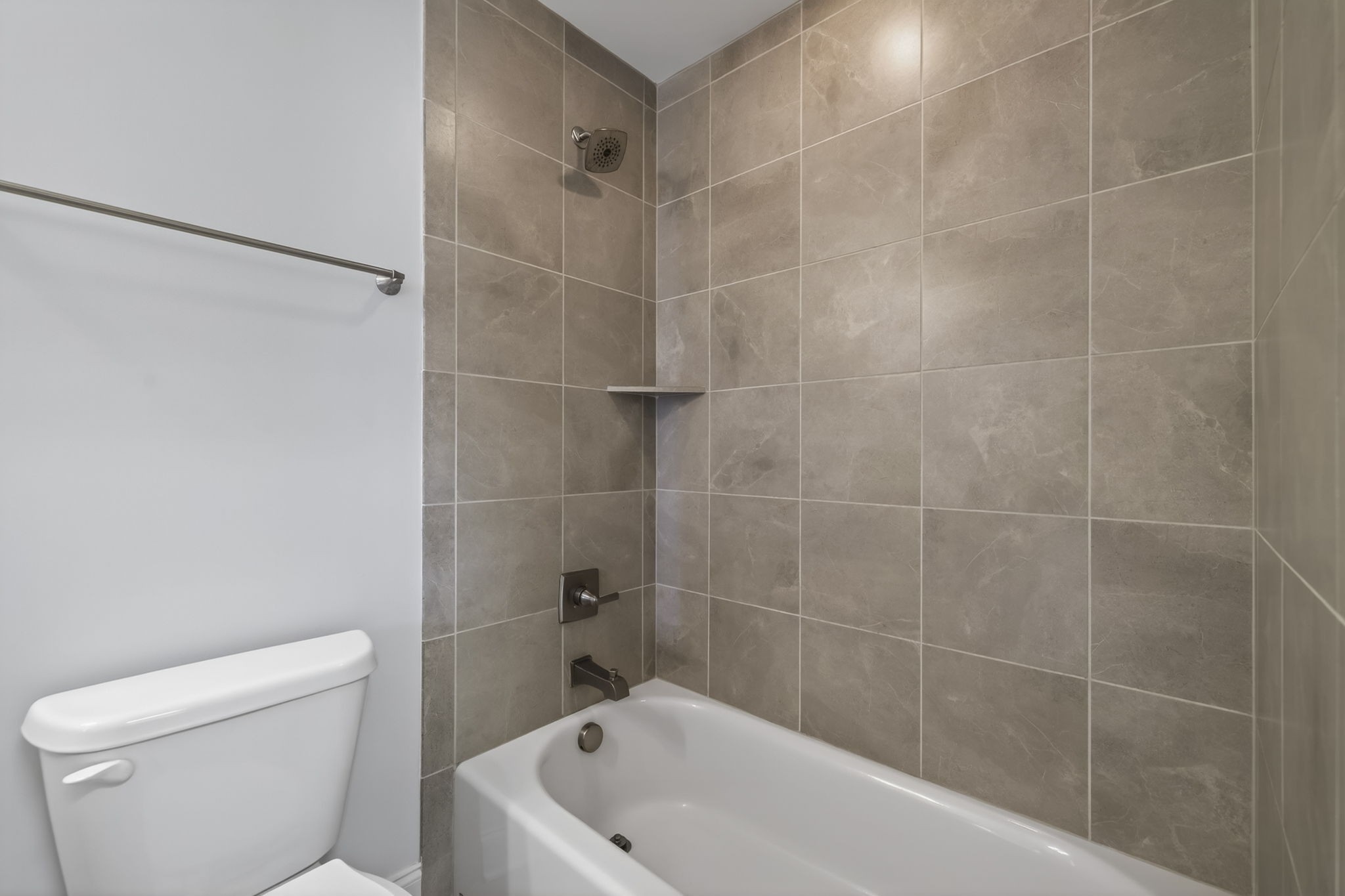 3062 Cheever Street Franklin, TN 37064 - Photo 40 of 51 a white bath tub sitting next to a white toilet and a sink