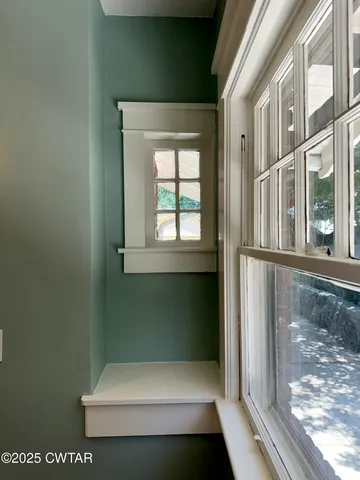 a view of walk in closet with window