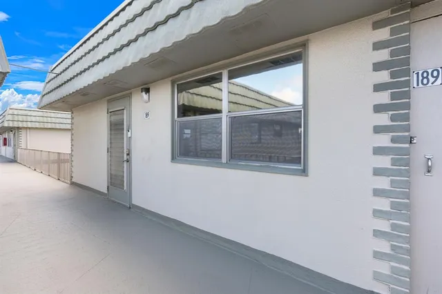 a view of a door and a window