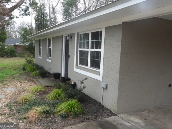 a house with trees in front of it