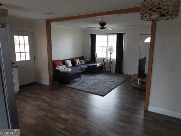 a living room with furniture and a window