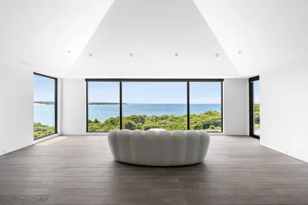 a view of an empty room with a large window