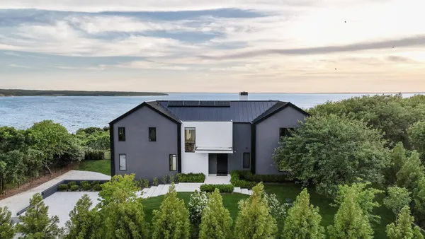 a house with trees in the background