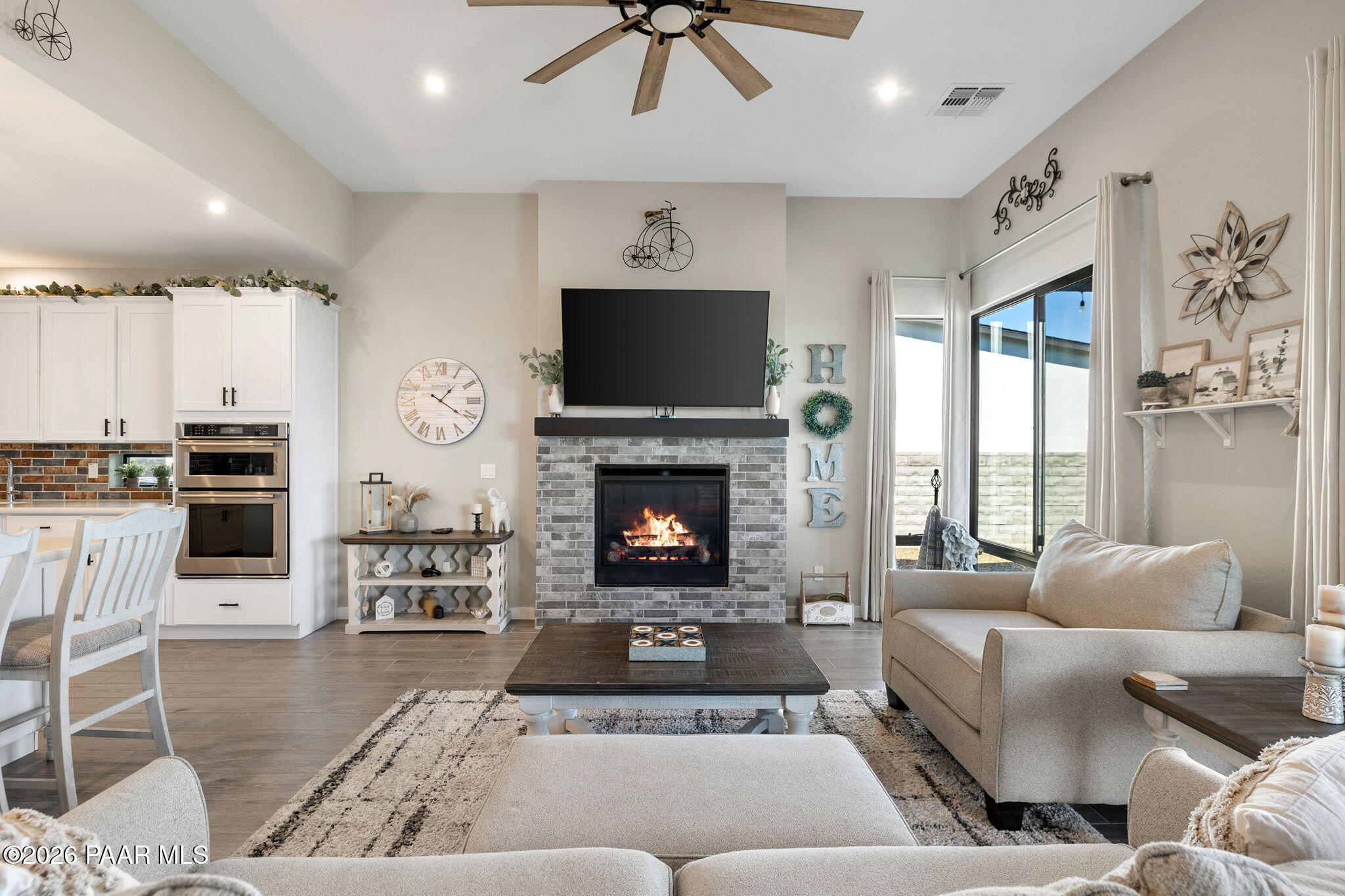 4882 North Yorkshire Loop Prescott Valley, AZ 86314 - Photo 11 of 28 a living room with furniture and a fireplace