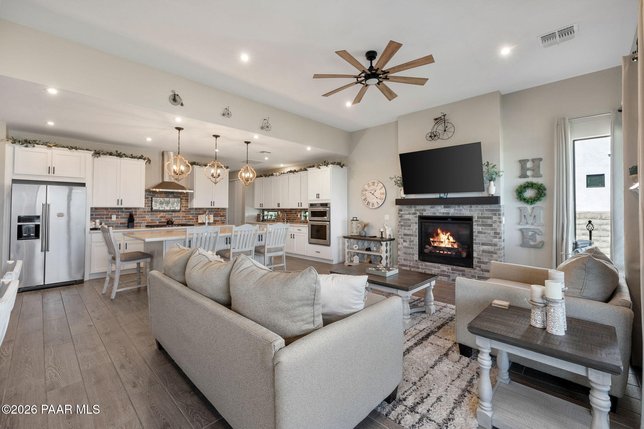 4882 North Yorkshire Loop Prescott Valley, AZ 86314 - Photo 15 of 28 a living room with furniture fireplace and a television