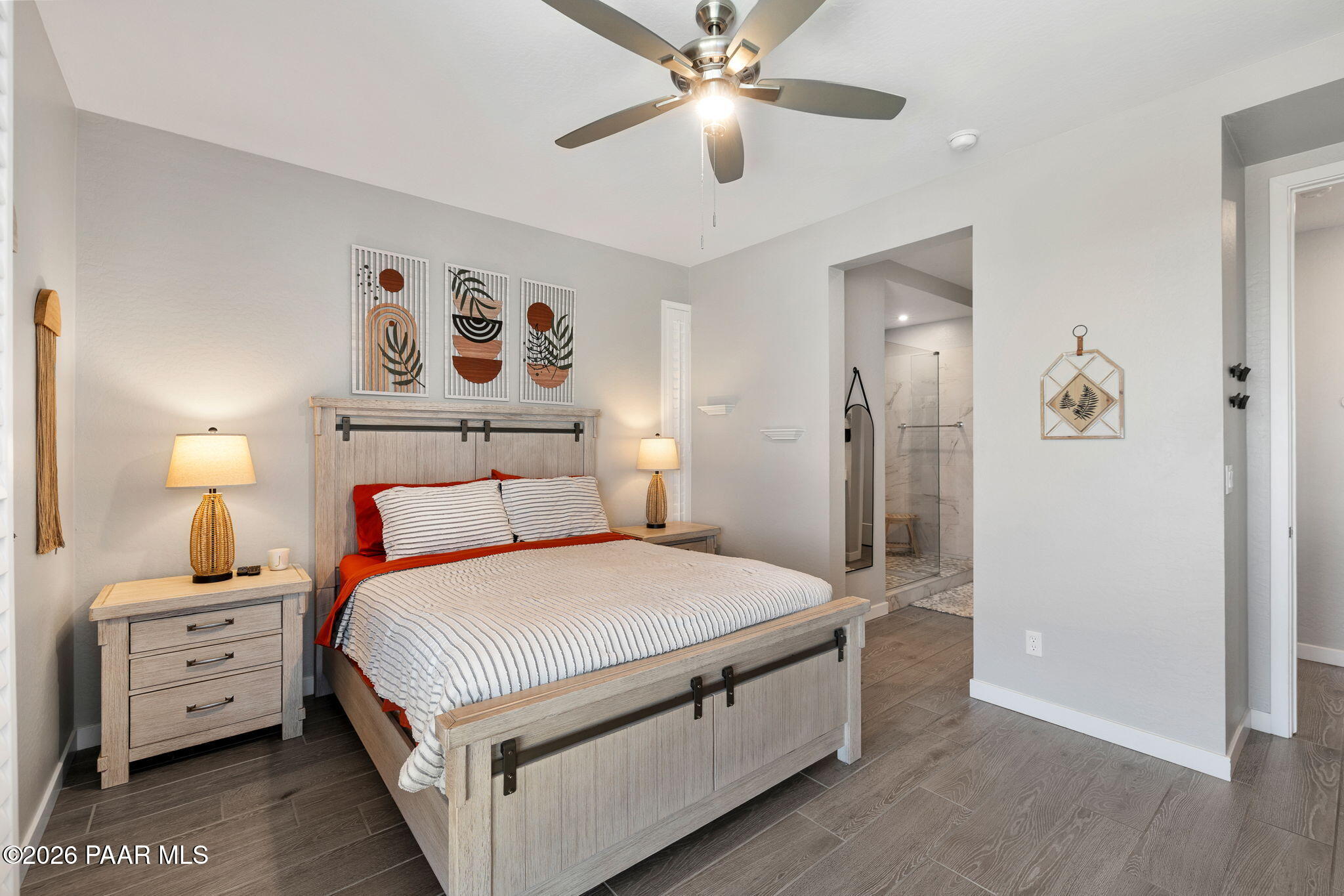 4882 North Yorkshire Loop Prescott Valley, AZ 86314 - Photo 19 of 28 a bedroom with a bed and a chandelier