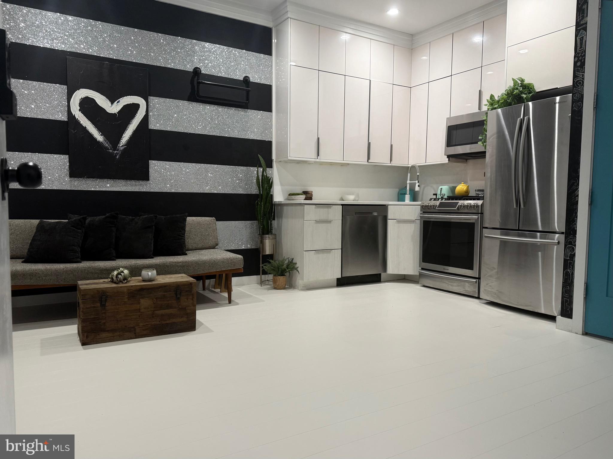 3527 14th Street Northwest, Unit 2 Washington, DC 20010 - Photo 1 of 9 a kitchen with stainless steel appliances and a refrigerator