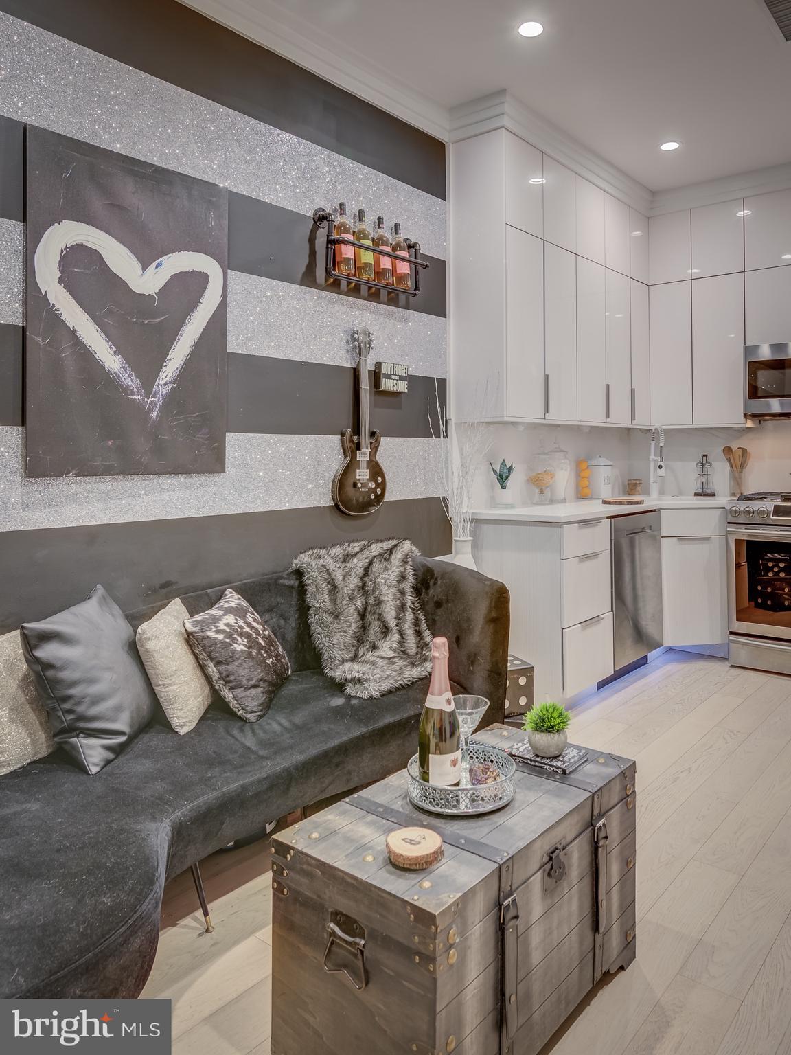 3527 14th Street Northwest, Unit 2 Washington, DC 20010 - Photo 6 of 9 a living room with furniture and kitchen view