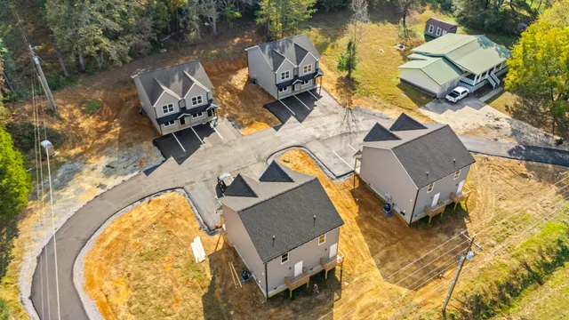 an aerial view of a house with a ocean view