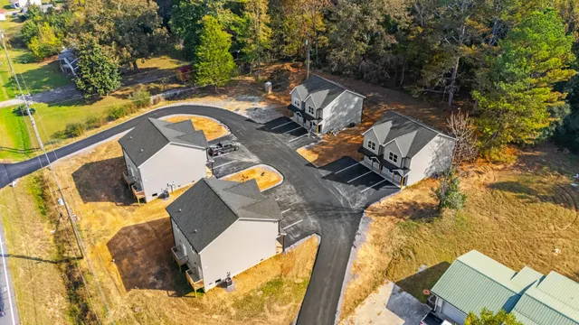 an aerial view of a house with swimming pool