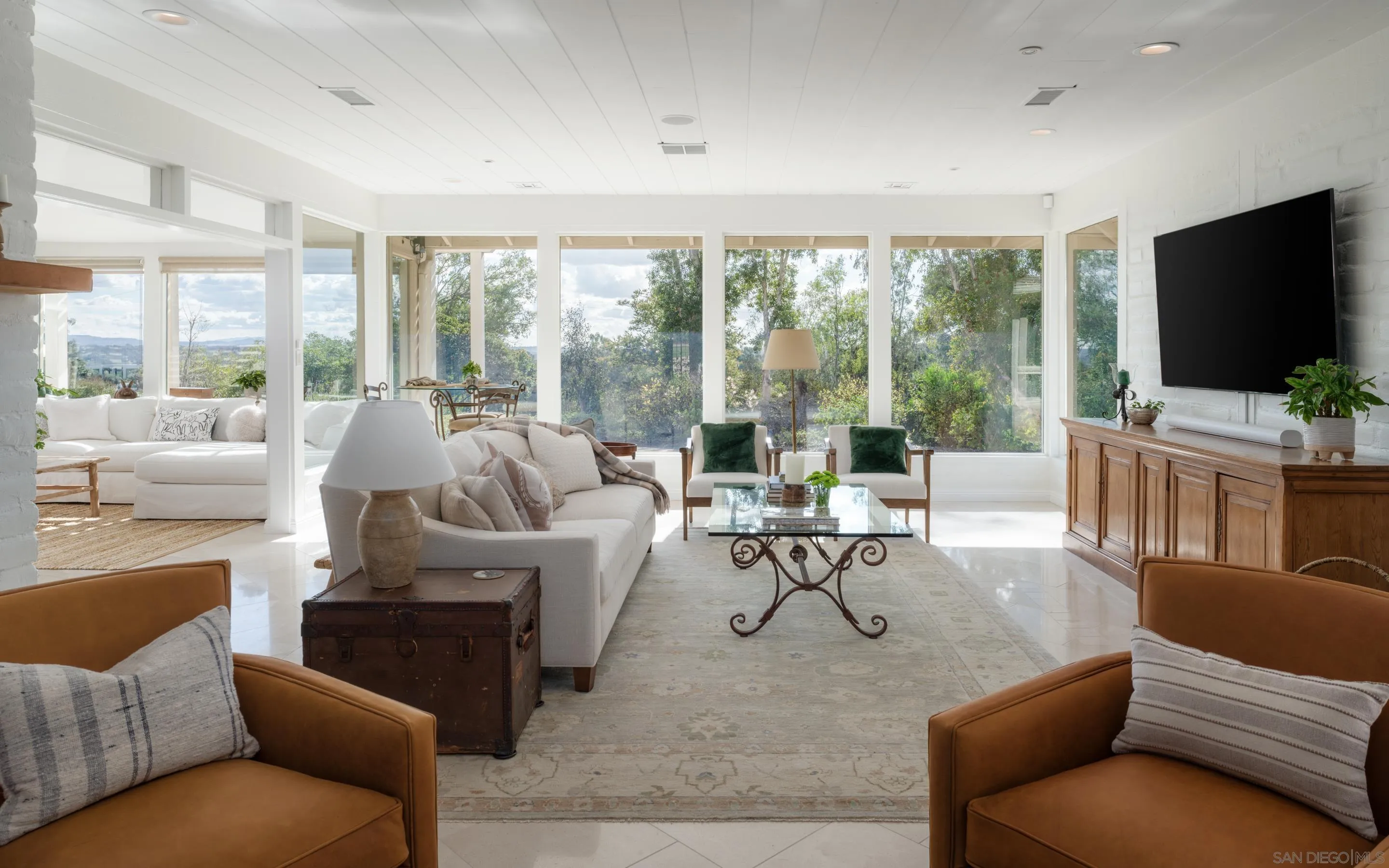5327 La Glorieta Rancho Santa Fe, CA 92067 - Photo 5 of 34 a living room with furniture a large window and a flat screen tv