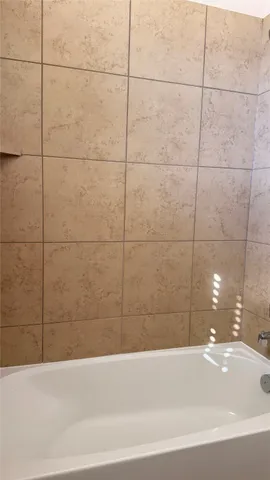 a bathroom with a bathtub